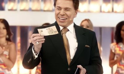 Silvio Santos distribui dinheiro no SBT (Foto: Reprodução)