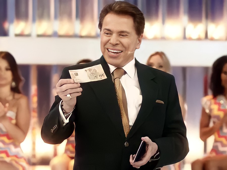 Silvio Santos distribui dinheiro no SBT (Foto: Reprodução)